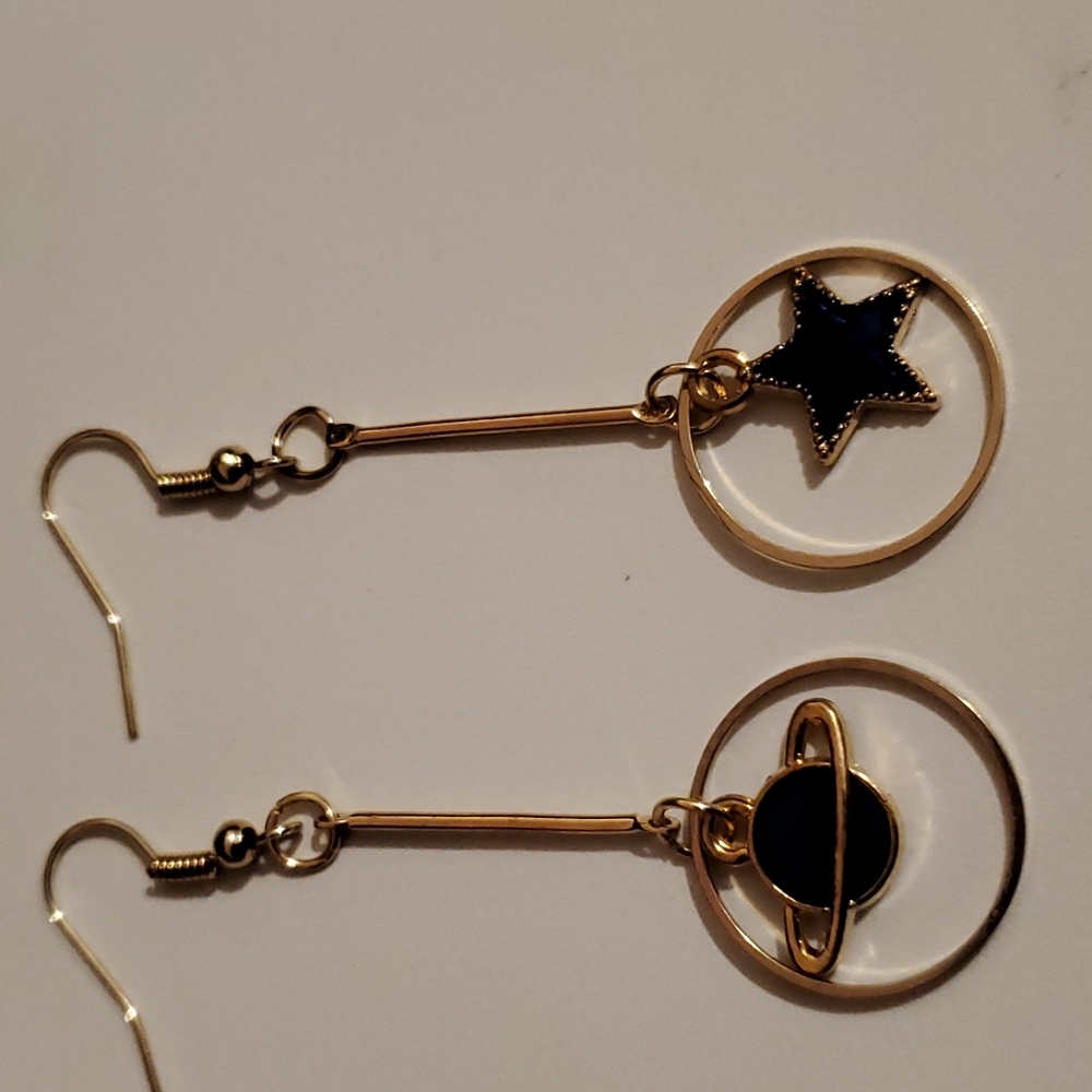 Gold Tone dangle star and moon earrings
